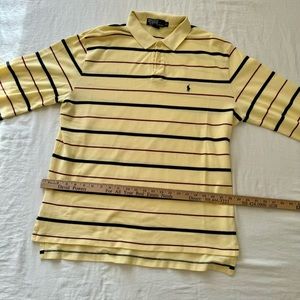 Yellow, black, and red striped polo shirt